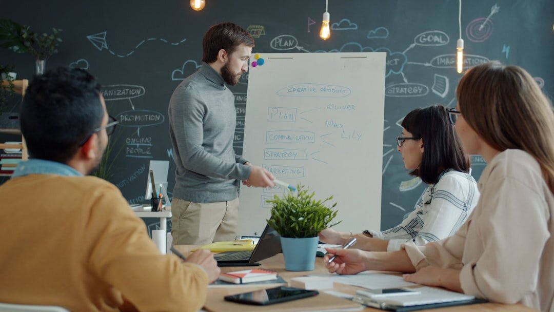 Team of business professionals in a meeting around a table in a modern Brussels office